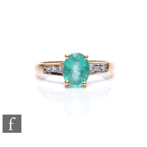 670 - An 18ct hallmarked emerald and diamond ring, central oval emerald flanked by three diamonds to each ... 