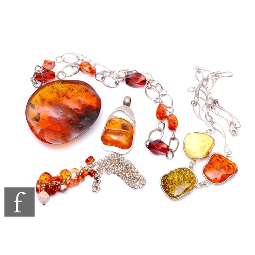 687 - Three silver and Baltic amber necklets, with a similar pendant and a piece of loose amber detailed w... 