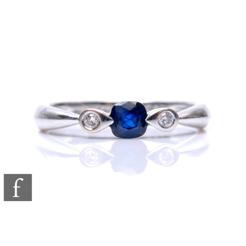 688 - An 18ct white gold sapphire and diamond three stone ring, central square cut sapphire flanked by dia... 