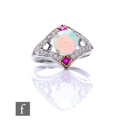 689 - A 14ct white gold opal, ruby and diamond cluster, central cabochon set opal with a ruby set above an... 