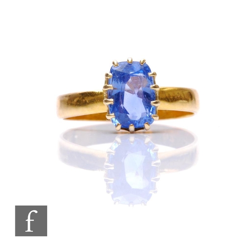 696 - A 22ct hallmarked single stone sapphire ring, cushioned rectangular claws set stone, length 8mm, wid... 