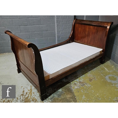 1101 - A late 19th Century mahogany lit en bateau, with scroll shaped head and foot boards, width 114cm and... 