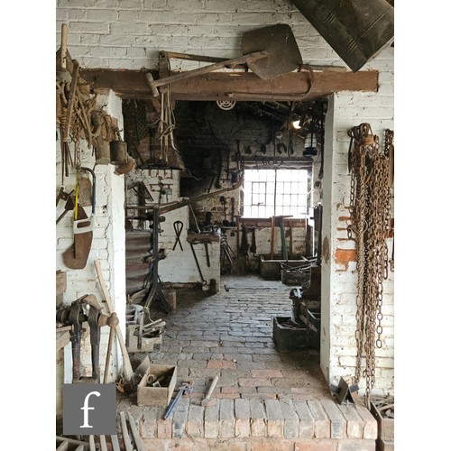 1115 - The contents of an entire working Victorian forge to include a large pair of hand operated studded l... 