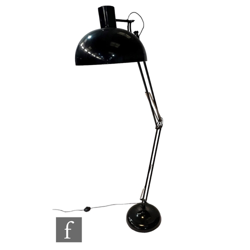 1168 - After Anglepoise - A black floor lamp, the domed base extending to an adjustable arm and shade, heig... 