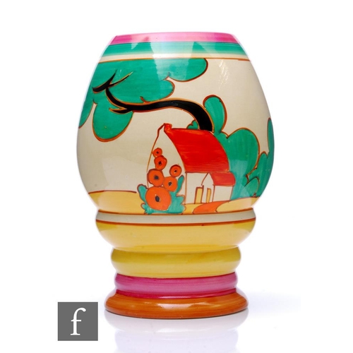Clarice Cliff - Red Roofs (pink variant) - A shape 362 vase circa 1931, hand painted with a stylised tree and cottage landscape with large two tone pink flowers to the reverse between pink, green, yellow and brown banding, FANTASQUE and Bizarre mark, height 20cm.