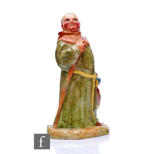 359 - Clarice Cliff - Friar Tuck - A figure modelled as a Friar in long robes with staff, also holding a d... 