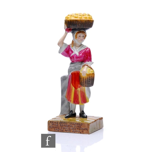 360 - Clarice Cliff - The Orange Seller - A figure modelled as a market seller with a basket of oranges on... 