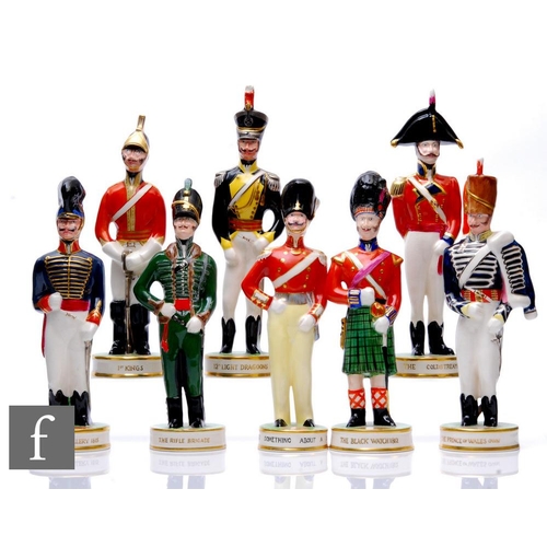 363 - Clarice Cliff - The Old Brigade - A complete set of eight figures modelled as military figures, circ... 