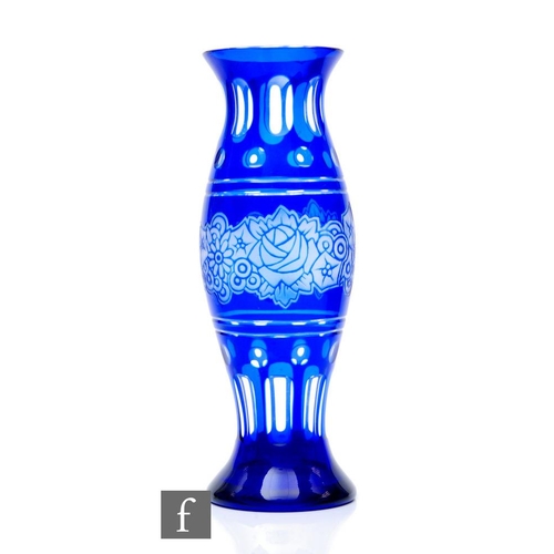 494 - Kralik – A large Art Deco glass vase of baluster form, cased in blue over clear, flash cut with a ce... 