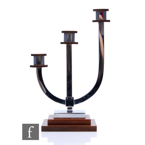 506 - Unknown - A 1930s Art Deco three sconce candlestick in chrome with brown detailing to the scones and... 