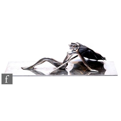 512 - Karl Hagenauer - A 1920s Austrian silvered bronze figure of a stylised female nude sunbathing with a... 