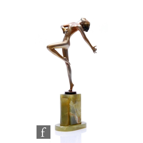 527 - Josef Lorenzl - An Art Deco patinated bronze figure of a female nude dancer, standing to one leg, th... 