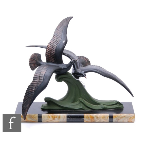 533 - Unknown - A French Art Deco spelter figure group depicting two seagulls in flight over a cresting wa... 