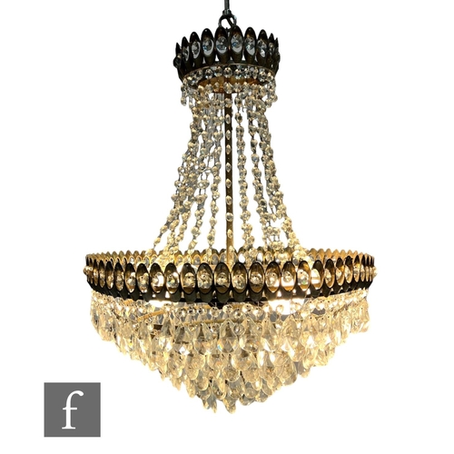 706 - Schonbek Luminaire - A 1970s six-light chandelier, the eight-tier gild metal frame with concentric c... 