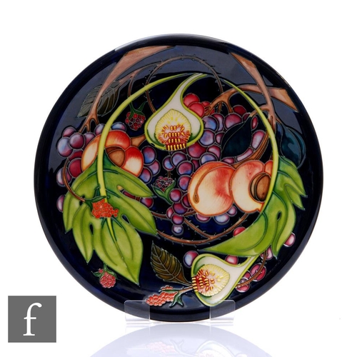 74 - Emma Bossons - Moorcroft Pottery - A plate of circular form, shape 783/10, decorated in the Queen's ... 