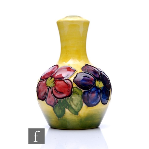 82 - Moorcroft Pottery - A small lamp base, of ovoid form with tall flared neck, decorated in the Yellow ... 