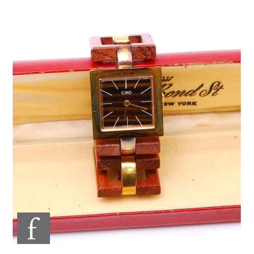 854 - Ciro - A boxed vintage wristwatch, the square dial with a brown tortoiseshell effect with a wooden s... 