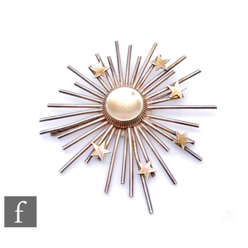 877 - Anton Michelson - A mid 20th Century Danish silver Starburst brooch, with applied stars over radiati... 