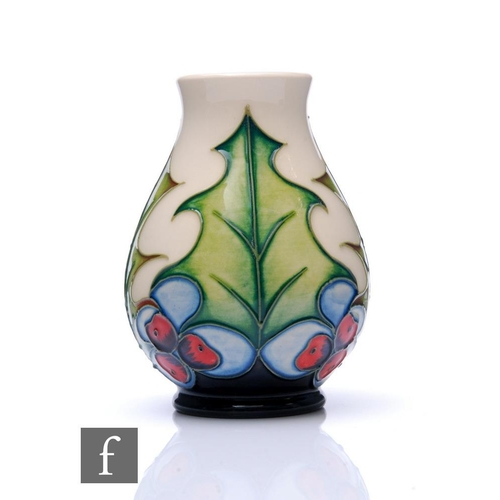 95 - Philip Gibson - Moorcroft Pottery - A small vase of ovoid form with flared neck, decorated in the Ho... 