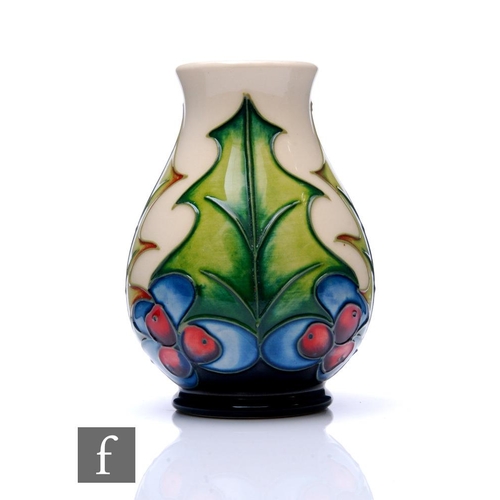 96 - Philip Gibson - Moorcroft Pottery - A small vase of ovoid form with flared neck, decorated in the Ho... 