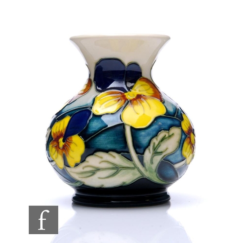 99 - Kerry Goodwin - Moorcroft Pottery - A small vase of squat ovoid form with flared neck, decorated in ... 