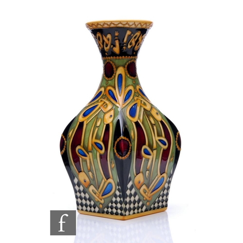 63 - Alicia Amison - Moorcroft Pottery - A vase of lobed form with flared neck, shape 31/9, decorated in ... 