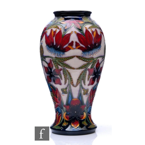 68 - Shirley Hayes - Moorcroft Pottery - A vase of baluster form, shape 46/10, decorated in the Delonix p... 