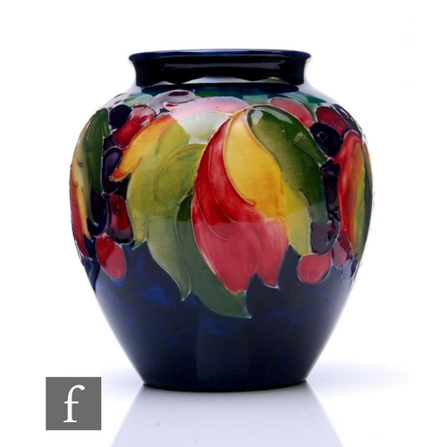 70 - William Moorcroft - A small vase of high shouldered ovoid form with everted rim, decorated in the Gr... 