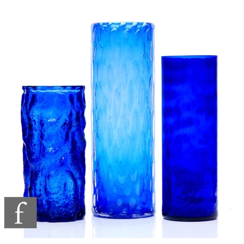 1004 - Unknown -  A large studio glass cylinder vase with controlled air bubbles over the blue ground, unma... 