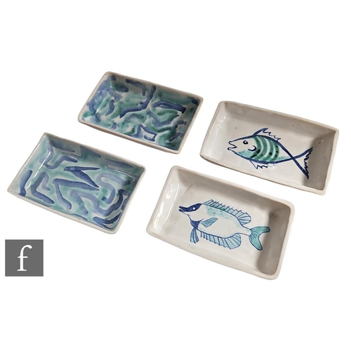 1081 - Unknown - A set of four contemporary rectangular dishes, each decorated by hand in tones of blue and... 