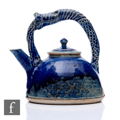 1088 - Michael Kennedy - A contemporary studio stoneware Lamprey teapot, of domed form with a loop handle m... 