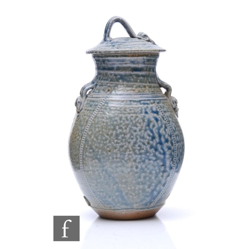 1093 - Barry Huggett - A contemporary studio stoneware lar lidded jar of ovoid form with applied decorative... 