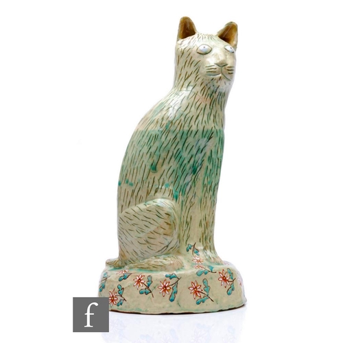 1105 - Hylton Nel - A large hand crafted studio pottery figure of a large seated cat with upright ears, dec... 
