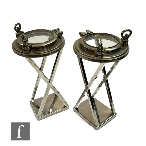 1182 - Eichholtz - A pair of porthole 'HMS Victory' side tables, each of the nickel finish tables, with luc... 