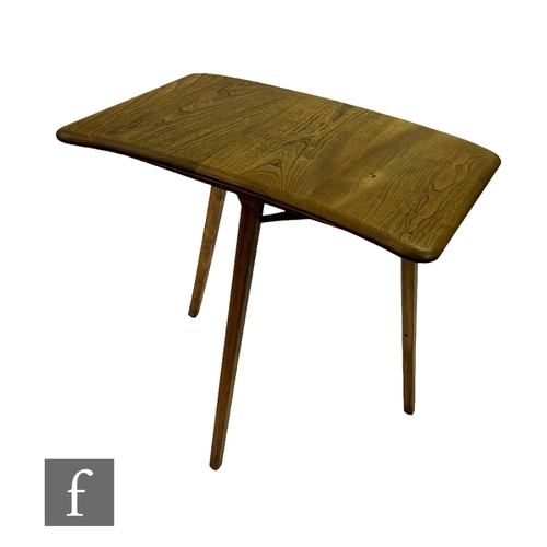 731 - Lucian Ercolani - Ercol Furniture - An elm model 265 end table on splayed beech legs, made as an ext... 