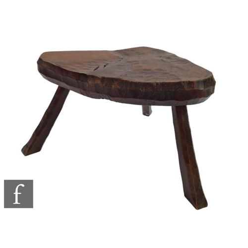 1184 - Jack Grimble - Cromer - A later 20th Century hand crafted stool with solid timber seat with carved d... 