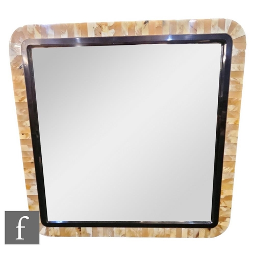 1183 - In the Manner of Anthony Redmile - A polished horn wall mirror of square section, the polished black... 