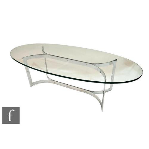 776 - In the manner of Merrow Associates - An oval smoked glass coffee table raised to a chromium plated f... 