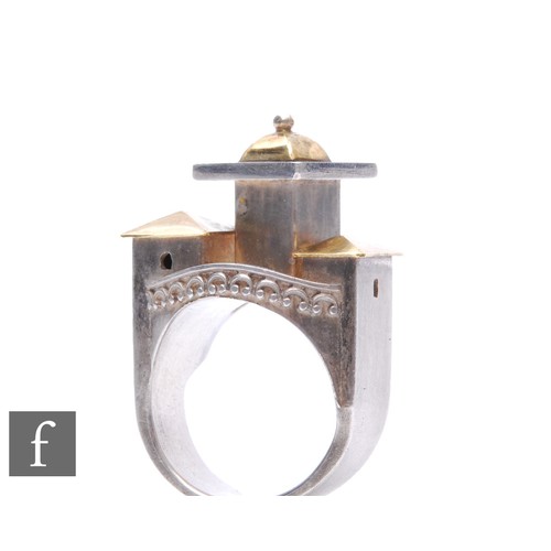 875 - Vicki Ambery-Smith - A contemporary silver and yellow gold ring, modelled with architectural studies... 