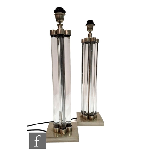 1171 - Eichholtz - A pair of Art Deco style table lamps, the square plinth chrome base rising to a series o... 