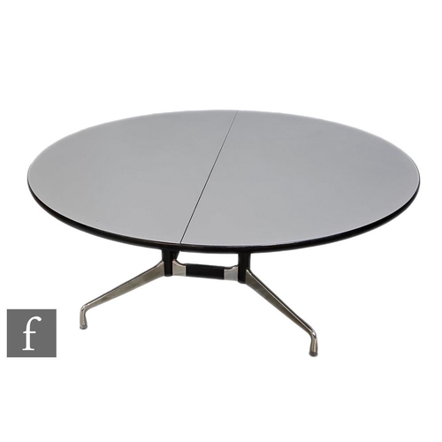 1179 - Charles & Ray Eames - Vitra - A segmented office group table, the twin piece grey laminated circ... 