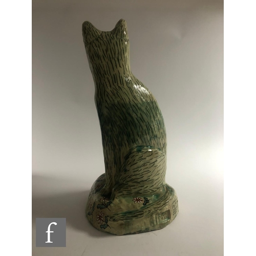 1105 - Hylton Nel - A large hand crafted studio pottery figure of a large seated cat with upright ears, dec... 