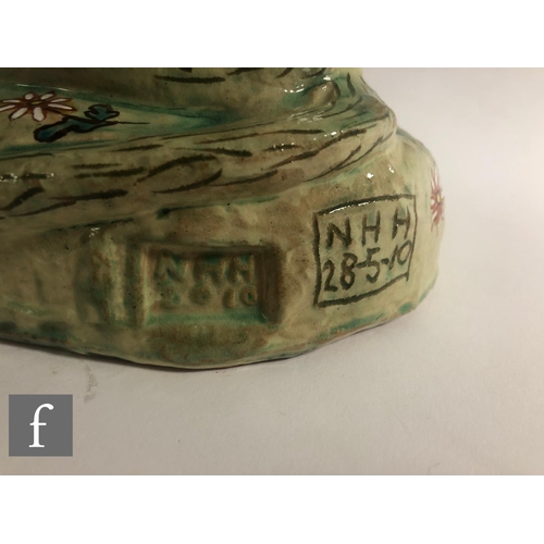 1105 - Hylton Nel - A large hand crafted studio pottery figure of a large seated cat with upright ears, dec... 