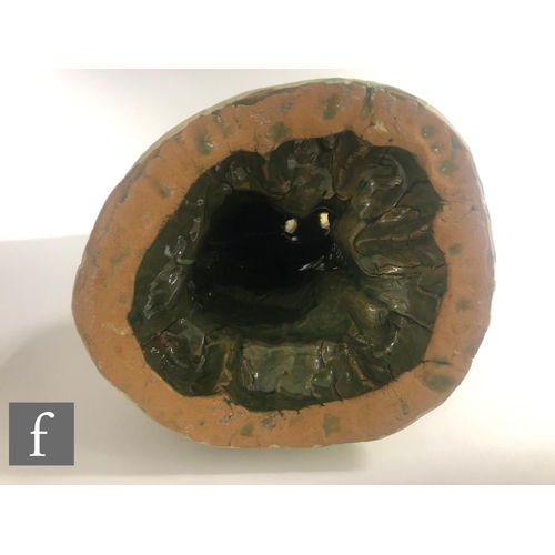 1105 - Hylton Nel - A large hand crafted studio pottery figure of a large seated cat with upright ears, dec... 