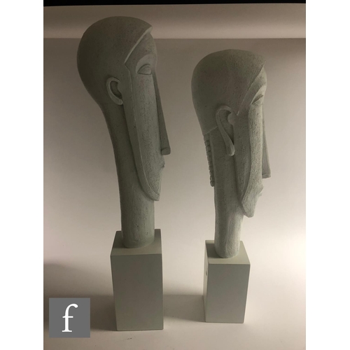 1132 - Artform - A graduated pair of contemporary sculptures depicting a stylised head of a man and woman i... 