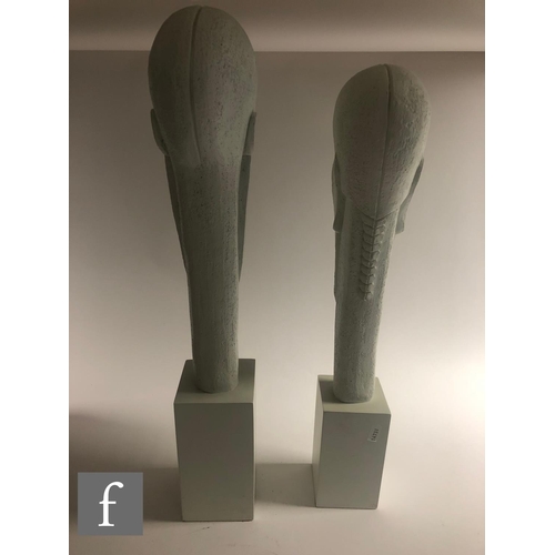 1132 - Artform - A graduated pair of contemporary sculptures depicting a stylised head of a man and woman i... 