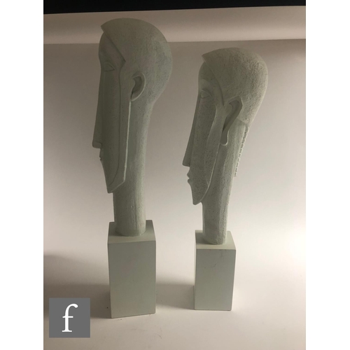 1132 - Artform - A graduated pair of contemporary sculptures depicting a stylised head of a man and woman i... 