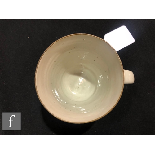 567 - Dame Lucie Rie - A stoneware cup, saucer and side plate circa 1950s, the cup of tapered form with lo... 