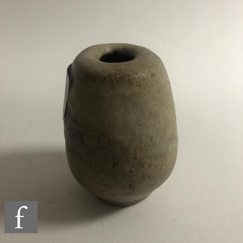 569 - Dame Lucie Rie - A small 'Potato' pot circa 1980, the compressed ovoid form with roll rim and oval a... 