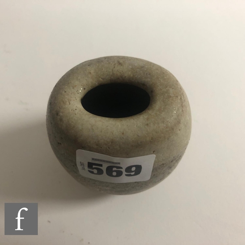 569 - Dame Lucie Rie - A small 'Potato' pot circa 1980, the compressed ovoid form with roll rim and oval a... 